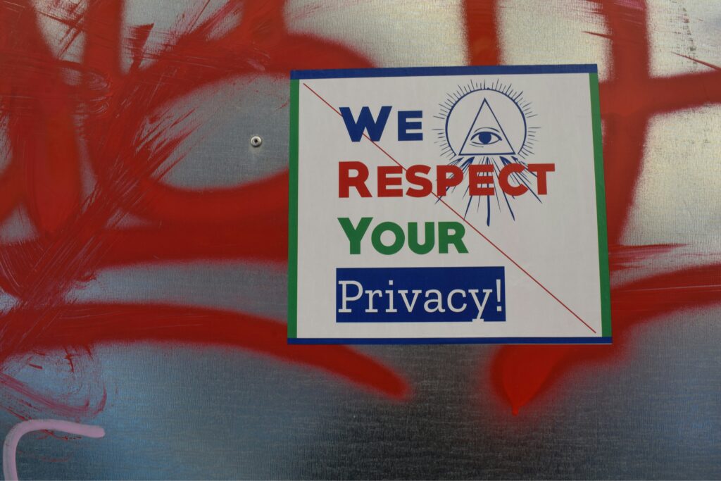 An image with a placard that reads "We Respect Your Privacy."