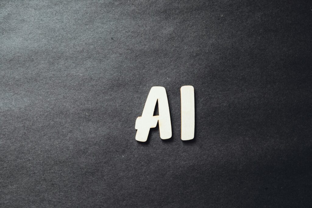 Image of a black background with two letters - AI - written in the middle.