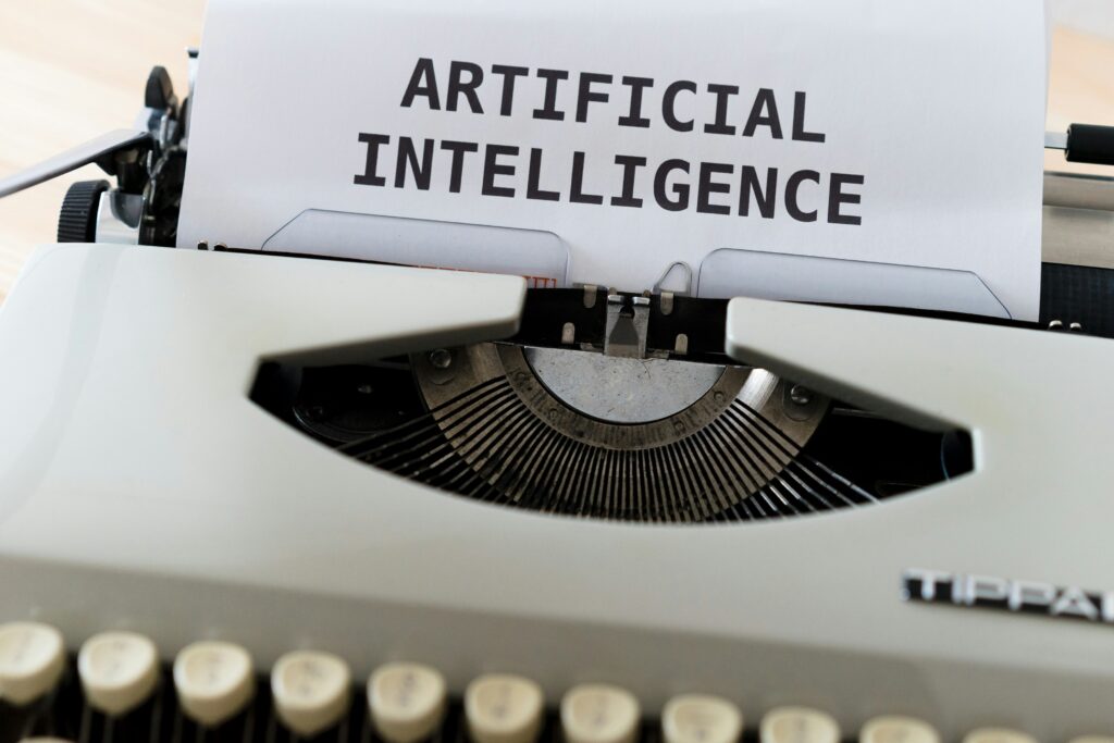 Image of a sheet written "Artificial Intelligence" coming out of a typerwriter.