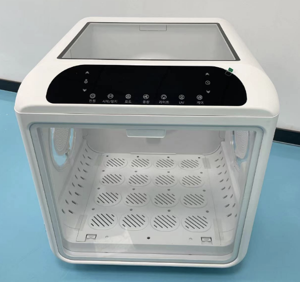 Image of a dryer with an observation screen on the top side